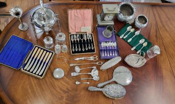 A collection of silver and silver plate including a silver hand mirror, hair brush and clothes