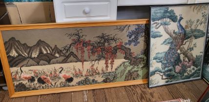 Two tapestries, an Oriental mountainous landscape depicting storks under a blossom tree, and another