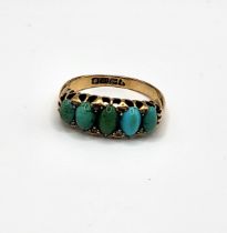 An 18ct yellow gold, turquoise, and diamond ring, set with five oval cabochon turquoise,