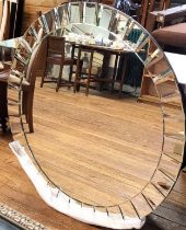A modern bevelled circular wall mirror 110cm