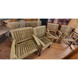 A wooden garden bench 162cm (w), together with four matching chairs.