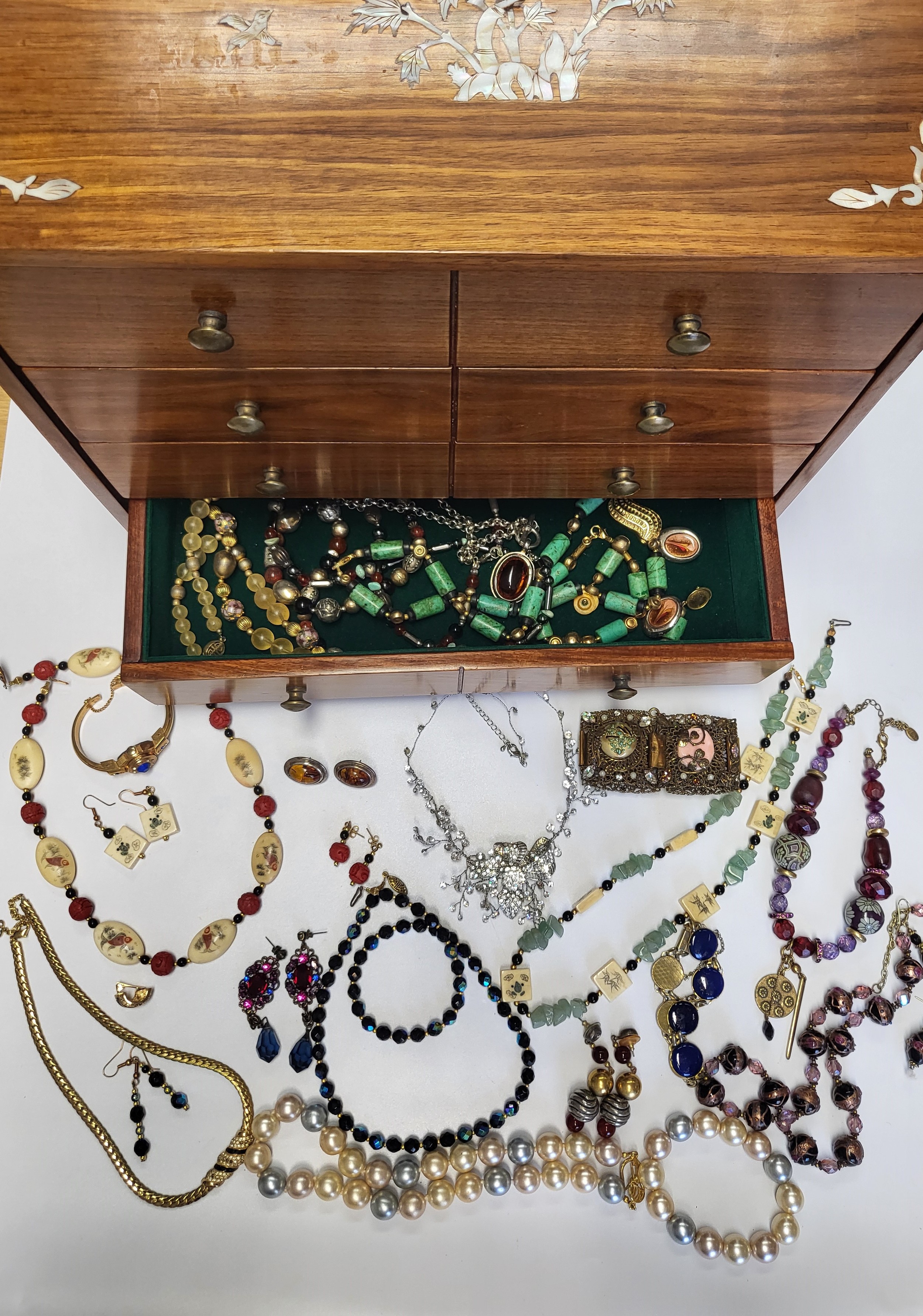 A collection of costume jewellery items, including various beaded necklaces, bracelets, etc.