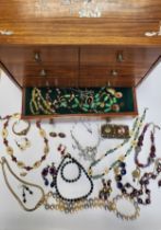 A collection of costume jewellery items, including various beaded necklaces, bracelets, etc.