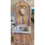 A fibre glass/ resin decorative garden water fountain / feature, decorated with a lion visage, abov