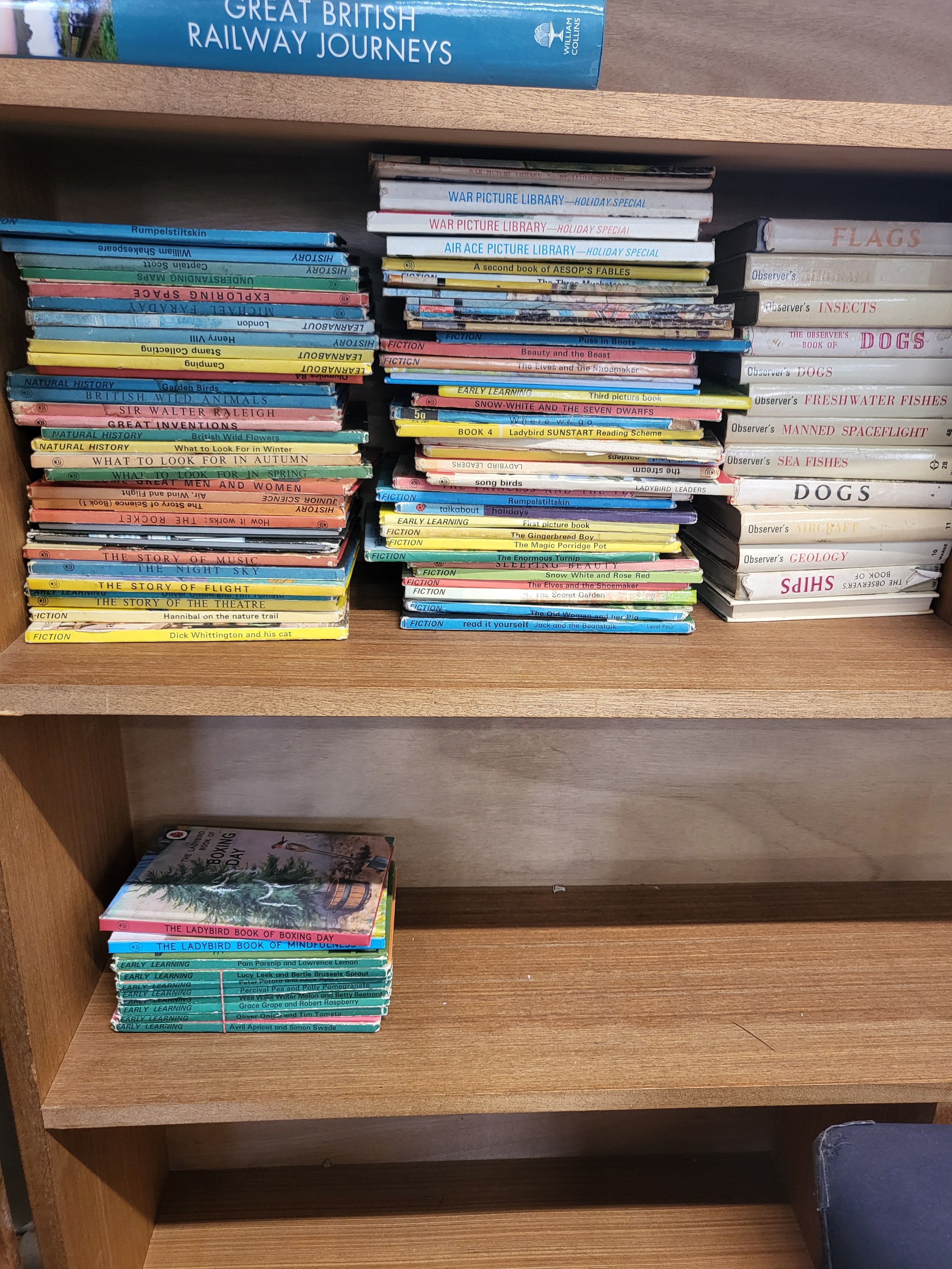 A collection of books including vintage Ladybird books