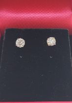 A pair of 14ct white gold diamond stud earrings of 72 points