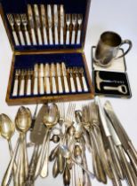 A group of silver plated items, including a Mappin & Webb tankard, various knives, forks, and