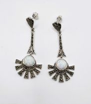 A pair of silver cubic circonia and marcasite fan shaped earrings with opalite panels