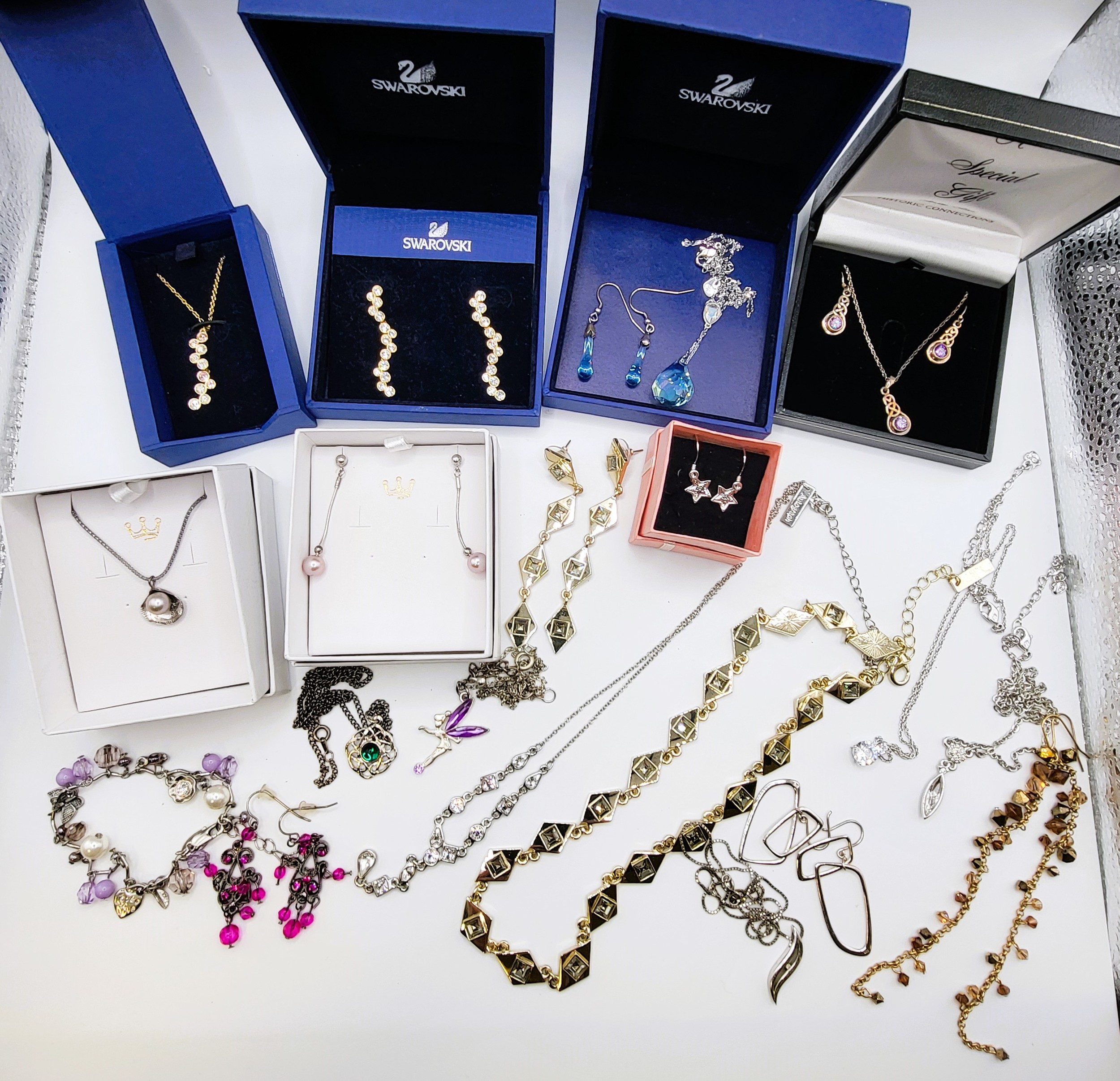 A group of various Swarovski necklaces and earrings (boxed), together with a group of sundry costume