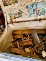 An old wooden box and carpentry tools