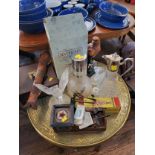A silver plate decanter, a glass bird, a ceramic bird of prey, a wooden box, a glass bottle (?)