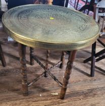 An Egyptian brass table top with barley twist legs, together with an oak child's chair. (2)
