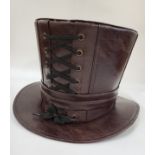 A Steampunk brown leather top hat, with laced detail, size M