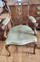 A late 19th / early 20th century style armchair, having decorative back splat, with upholstered arms
