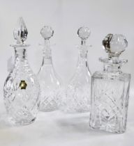 Four glass decanters with stoppers 25cm to 29.5cm (4)