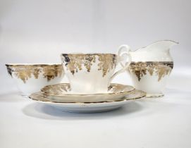 A porcelain part tea service with gilt grape vine pattern (lacks teapot) (37)