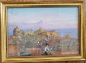 An oil painting of a city by the sea, with a seated woman in the foreground, framed and glazed. 30cm
