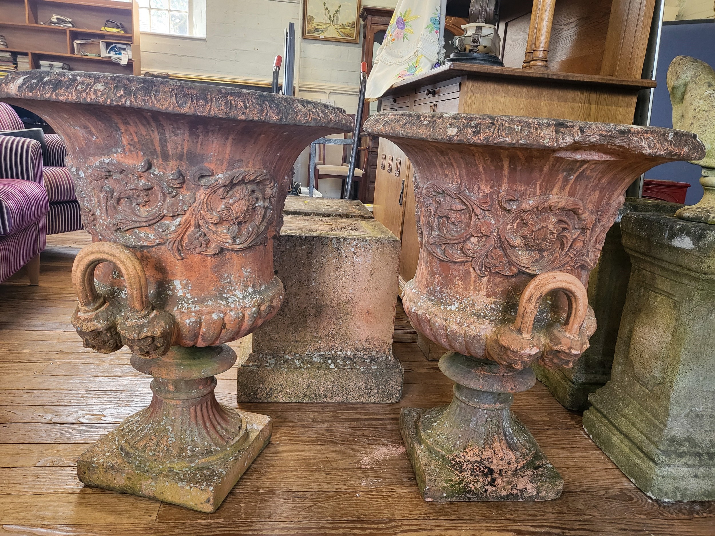 A pair of large red stone campagna shaped urns (80cm x 66cm), with everted rims and twin handles, - Image 2 of 3