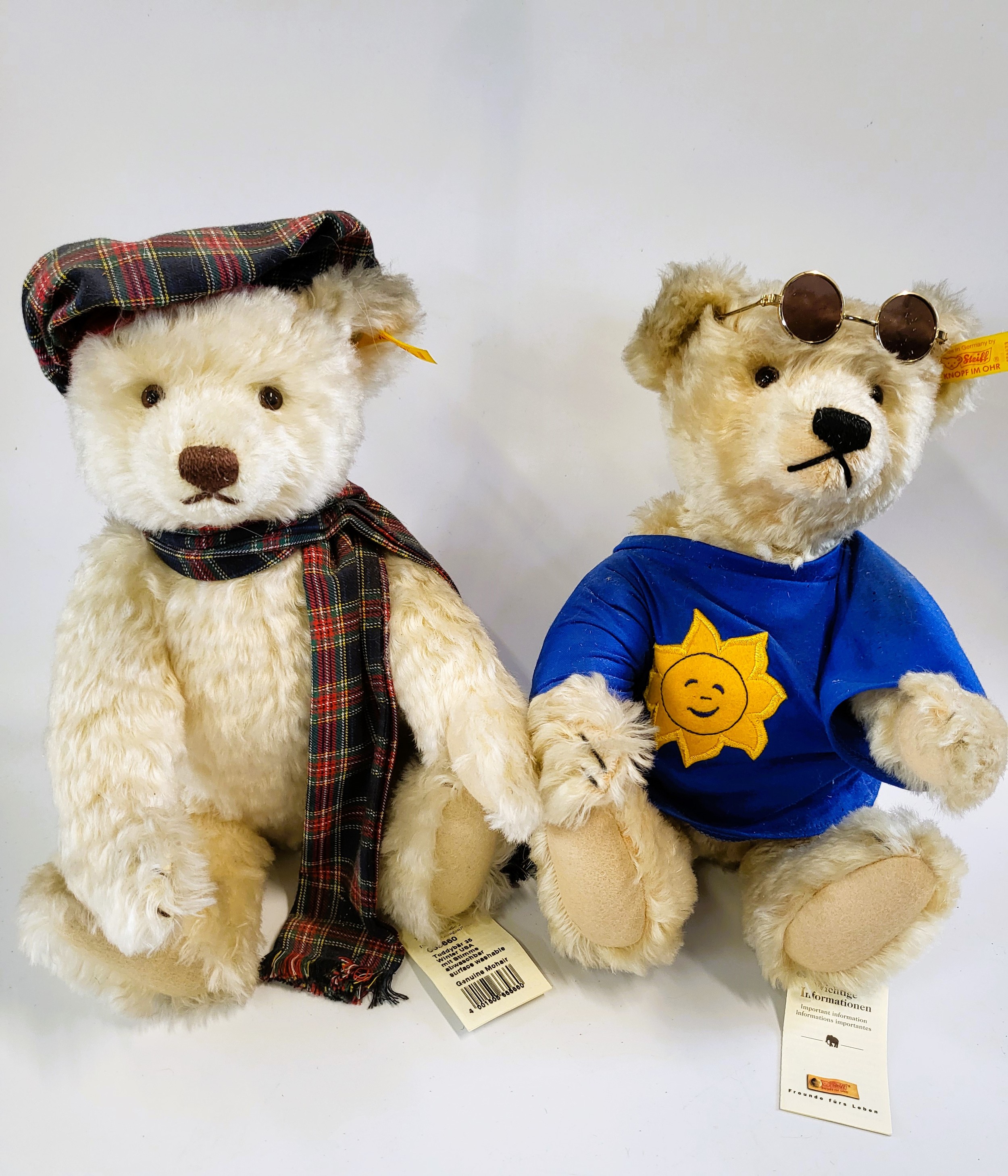 A Steiff white Summer Bear and white Winter USA Bear, both 35cm. (2)