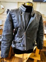 1970 motorcycling clothing including a Skin brand, size medium leather jacket (well worn), a pair of