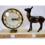 An Art Deco clock with a bronze fawn, on a marble plinth.