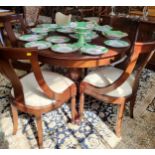 A circular extendable reproduction table and four chairs, table is 112cm with a single centre