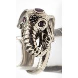 A substantial novelty silver elephant shaped ring, set with red stones.