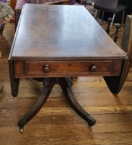An early 20th century Pembroke table, drop-leaf, with fitted drawer to one end, supported on