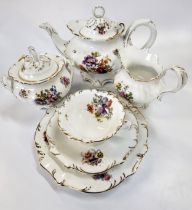 A porcelain tea service with printed floral pattern. (42)