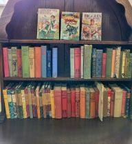 A collection of vintage and antique books, some first editions, including a first edition Biggles