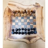 A modern olive wood chess set 30cm x 33cm with 32 pieces plus small drawers for pieces. Being sold