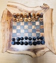 A modern olive wood chess set 30cm x 33cm with 32 pieces plus small drawers for pieces. Being sold