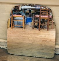 An Art Deco bevelled mirror with scolloped edge to top. 74cm x 64cm.