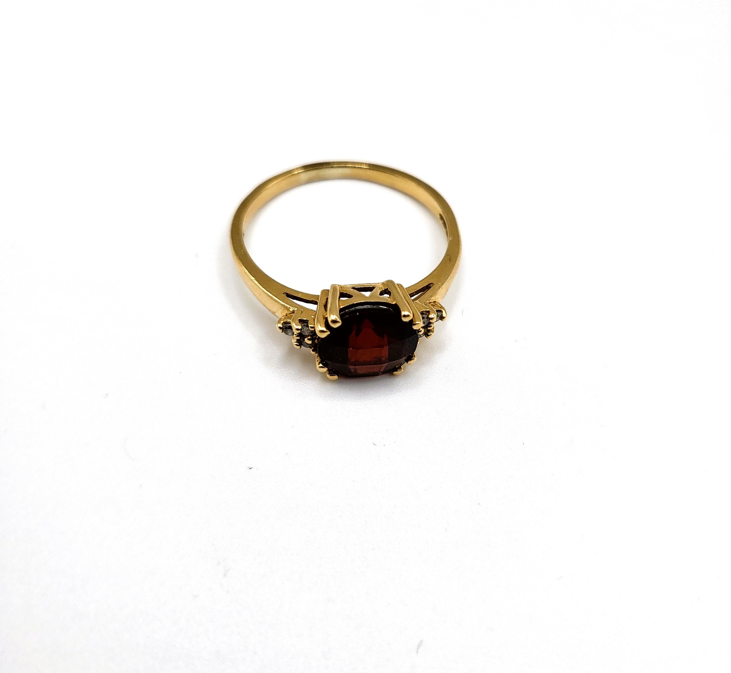 A 9ct yellow gold, diamond, and garnet ring, set with a round chequerboard-cut garnet, size P 1/2, - Image 3 of 5