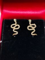 A pair of 9ct yellow gold diamond set snake earrings.