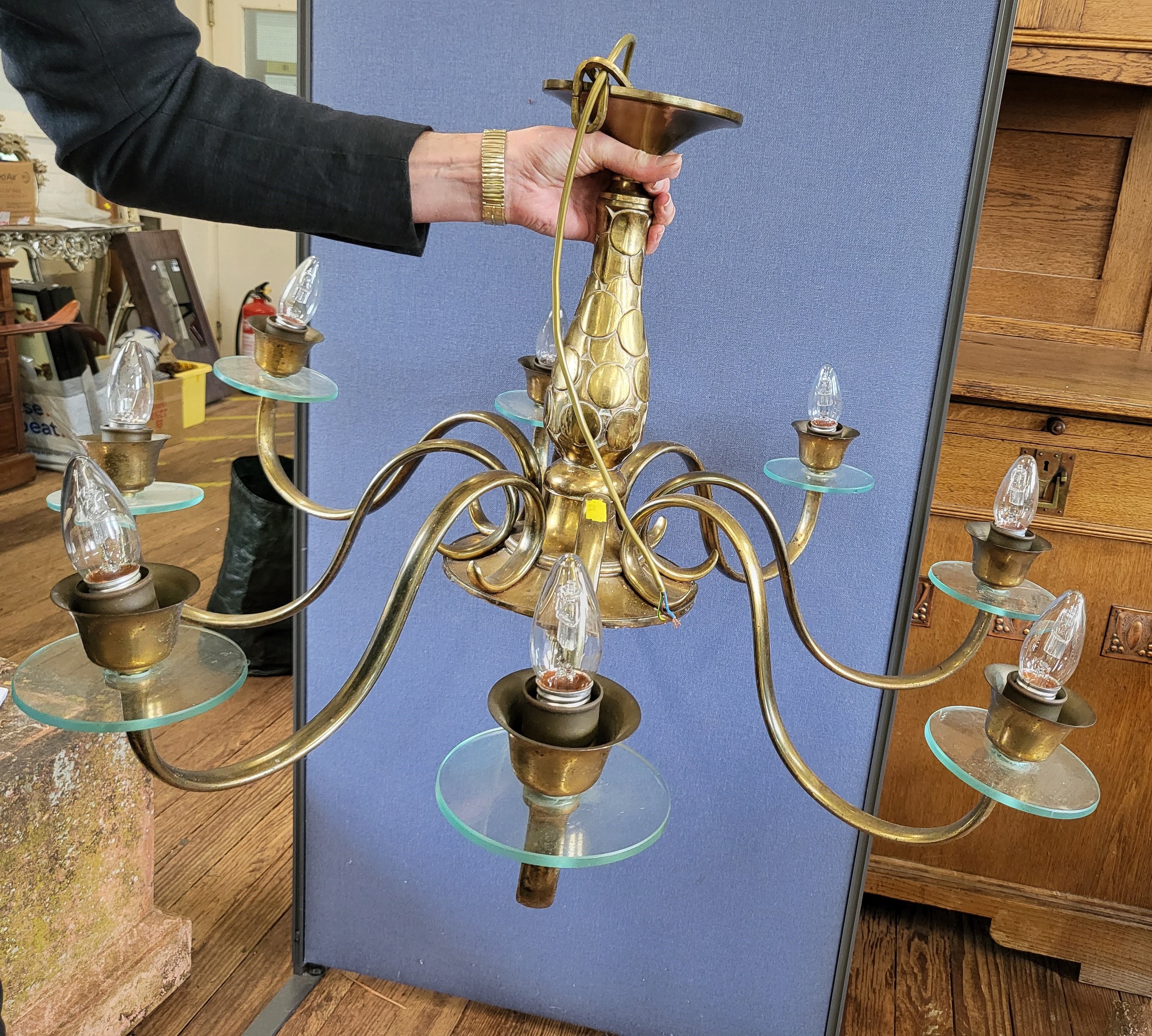 A brass eight armed ceiling light fitting, 54cm x 90cm.