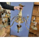 A brass eight armed ceiling light fitting, 54cm x 90cm.