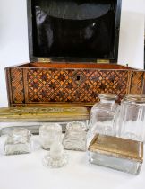 An inlaid wooden box, together with a group of glass bottles.