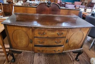 A mahogany sideboard, two doors, three drawers, on cabriole legs. Brass handles and key. 114cm x