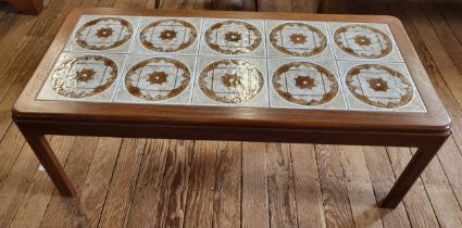 A 1970's G Plan tiled coffee table 40cm x 111cm x 51cm.