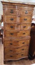 A walnut chest-on-chest two short drawers over three drawers to the top section and three drawers to