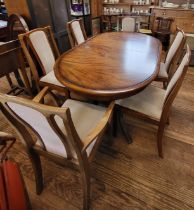 A Meredew extending dining table and six chairs (including two carvers). 74cm x 148cm x 95cm,