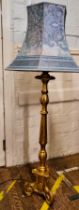 A gilt painted standard lamp. 150cm including shade