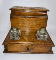 A gentleman's desk set with stationery box and inkwells. Oak, 1900.