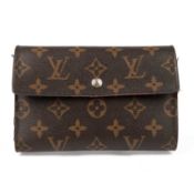 A ladies Louis Vuitton Paris wallet In monogram canvas and tan leather lining, with popper
