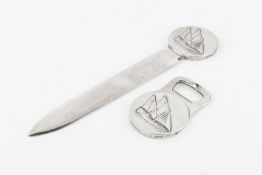 A silver plated letter opener and bottle opener by Christofle, relief decorated with dhows and