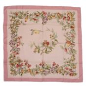 A Tiffany & Co silk scarf in shades of pale pink Featuring birds, berries and greenery Circa 87cm