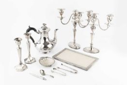 A pair of George V silver candlesticks, of tapered hexagonal form on weighted bases, Chester 1921,