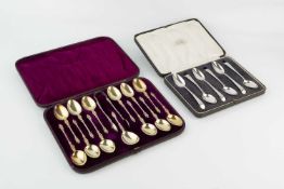 A set of twelve mid-Victorian silver gilt apostle top teaspoons, with matching sugar tongs and caddy