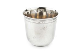 An 18th century French silver beaker, of plain form with a band of reeded decoration to the